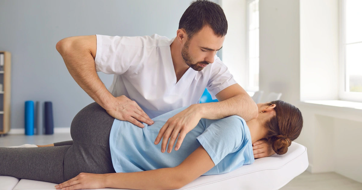 Chiropractor Treating Woman